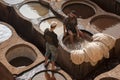 FEZ, MOROCCO Ã¢â¬â FEBRUARY 20, 2017 : Men working at the famous Chouara Tannery in the medina of Fez, Morocco Royalty Free Stock Photo